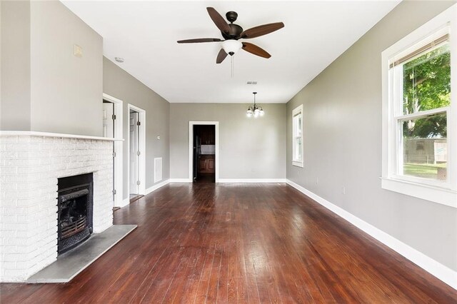 316 Milling Ave, Luling, LA 70070 - unfurnished living room featuring a ceiling fan, a fireplace, wood-type flooring, and baseboards