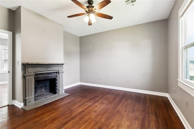 316 Milling Ave, Luling, LA 70070 - unfurnished living room featuring a ceiling fan, dark wood-style floors, baseboards, and a fireplace