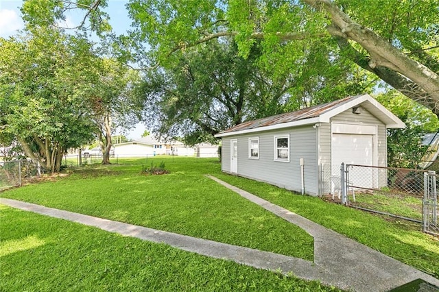 316 Milling Ave, Luling, LA 70070 - view of yard featuring an outbuilding and a detached garage