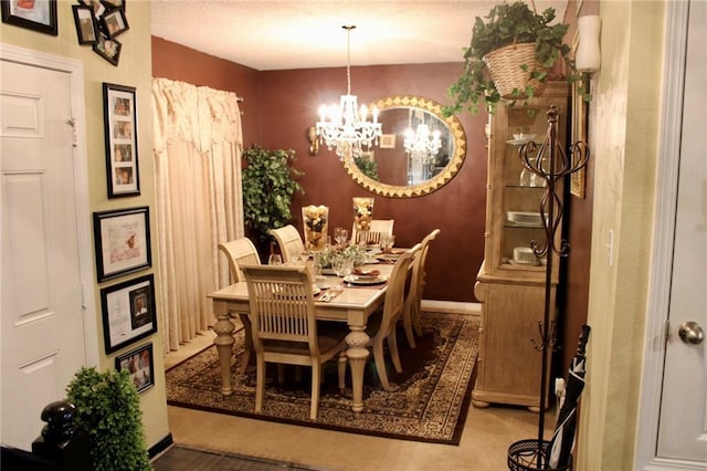 2132 Wellington Ln, Slidell, LA 70461 - dining area with a chandelier and baseboards