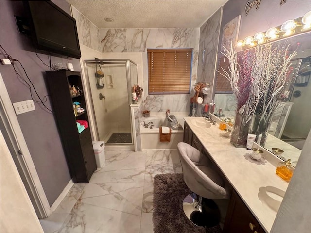 2132 Wellington Ln, Slidell, LA 70461 - full bathroom featuring marble look tiles, a stall shower, a bath, a textured ceiling, and double vanity