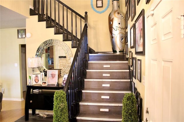 2132 Wellington Ln, Slidell, LA 70461 - stairway with baseboards and wood finished floors