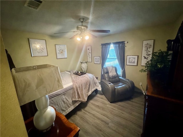 2132 Wellington Ln, Slidell, LA 70461 - bedroom with wood finished floors and ceiling fan