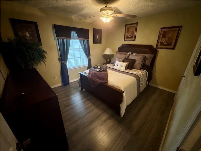 2132 Wellington Ln, Slidell, LA 70461 - bedroom with a textured ceiling, wood finished floors, ceiling fan, and baseboards