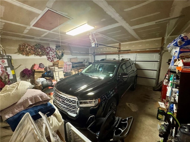 2132 Wellington Ln, Slidell, LA 70461 - garage with electric water heater and a garage door opener