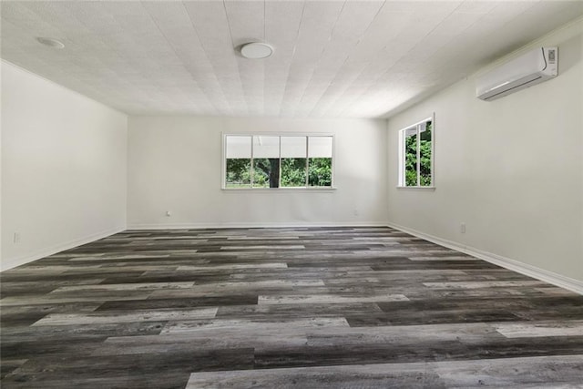 60078 W Park Cir, Lacombe, LA 70445 - spare room with a wall mounted AC, wood finished floors, and baseboards