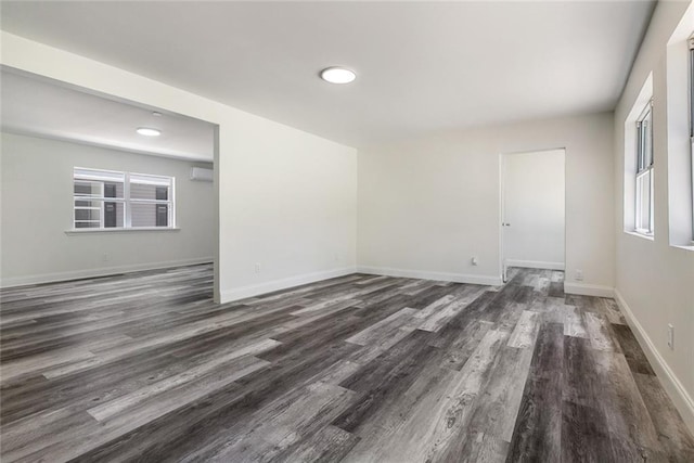 60078 W Park Cir, Lacombe, LA 70445 - spare room with wood finished floors, baseboards, and a wall unit AC