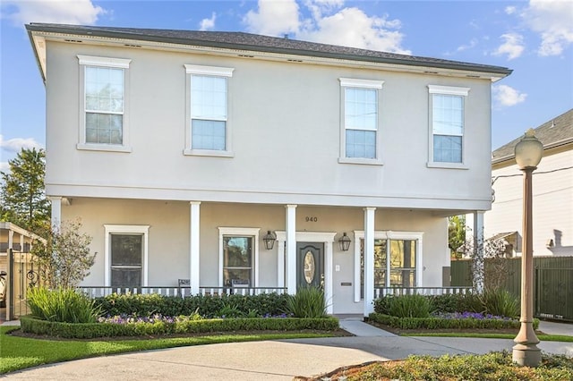 940 Orion Ave, Metairie, LA 70005 - view of front of property with a porch, stucco siding, and fence