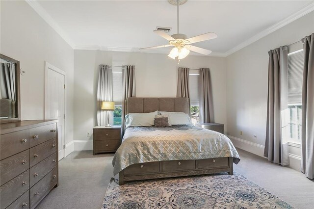 940 Orion Ave, Metairie, LA 70005 - carpeted bedroom with multiple windows, ornamental molding, baseboards, and ceiling fan