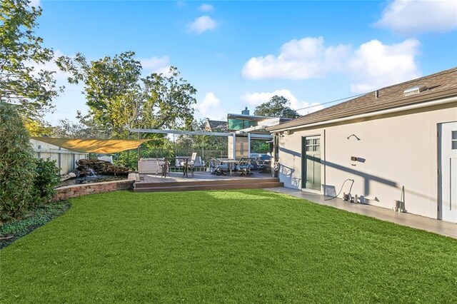 940 Orion Ave, Metairie, LA 70005 - view of green lawn featuring a wooden deck