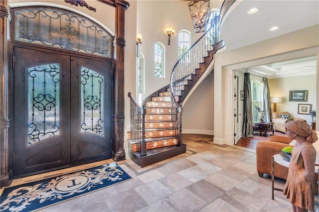 11 Arbor Cir, New Orleans, LA 70131 - entryway featuring french doors, stairway, baseboards, healthy amount of natural light, and a high ceiling