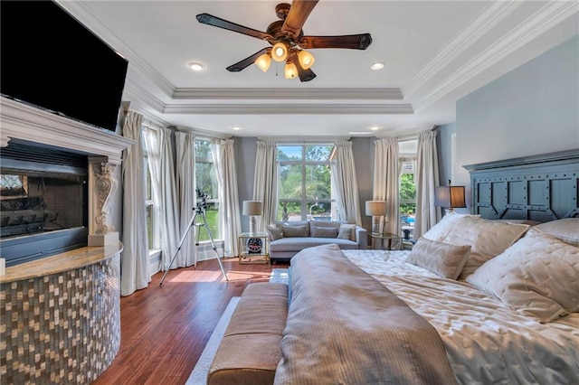 11 Arbor Cir, New Orleans, LA 70131 - bedroom featuring wood finished floors, crown molding, a raised ceiling, a fireplace, and access to exterior