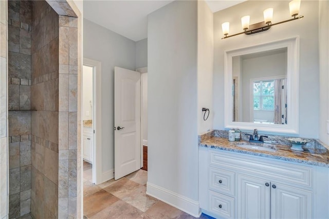 11 Arbor Cir, New Orleans, LA 70131 - bathroom with vanity, a tile shower, and baseboards