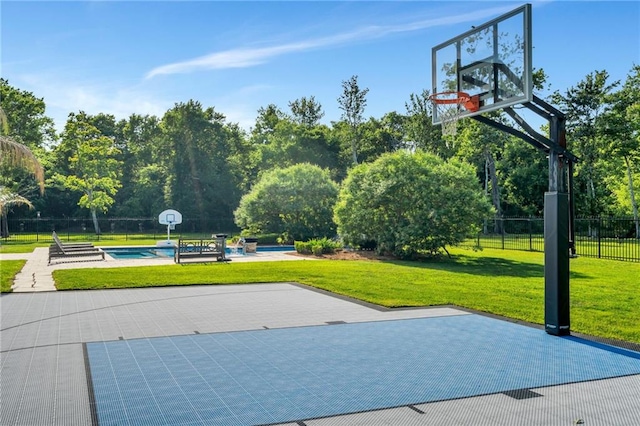 11 Arbor Cir, New Orleans, LA 70131 - view of sport court featuring basketball hoop and view of wooded area