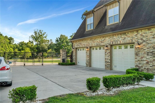 11 Arbor Cir, New Orleans, LA 70131 - view of home's exterior featuring fence, board and batten siding, a shingled roof, concrete driveway, and brick siding