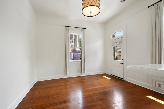 912 Spain St, New Orleans, LA 70117 - foyer entrance featuring wood-type flooring, healthy amount of natural light, and baseboards