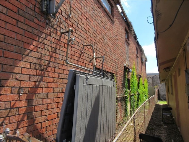 3900 Royal St, New Orleans, LA 70117 - view of side of property with brick siding and fence