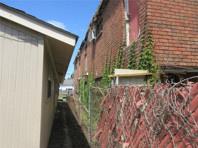 3900 Royal St, New Orleans, LA 70117 - view of home's exterior featuring fence and brick siding