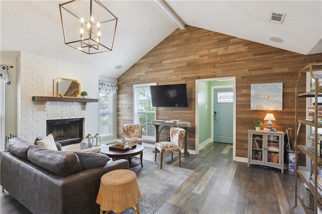 living area featuring wood walls, high vaulted ceiling, a chandelier, wood finished floors, and beam ceiling