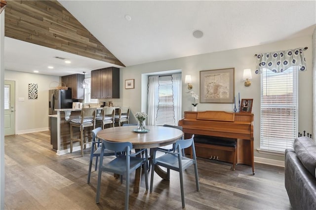 dining area with light wood-style floors, baseboards, high vaulted ceiling, and recessed lighting