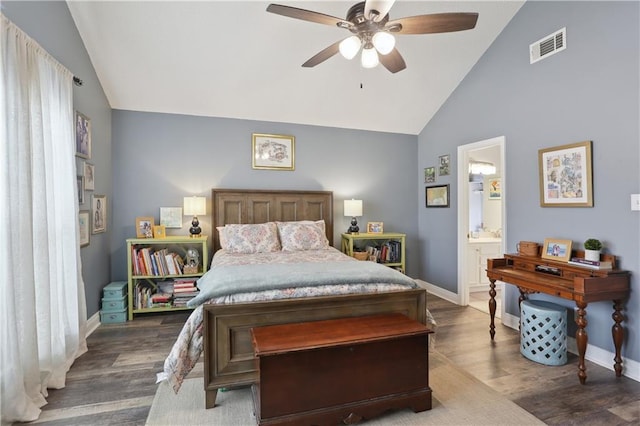 bedroom featuring baseboards, dark wood finished floors, a ceiling fan, and high vaulted ceiling