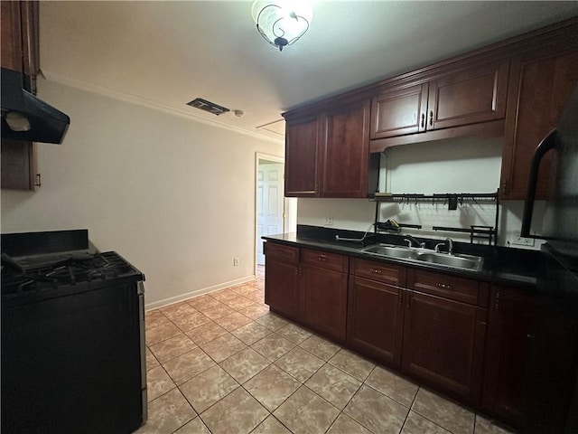 3855 Metropolitan St, New Orleans, LA 70126 - kitchen featuring stainless steel range with gas stovetop, under cabinet range hood, dark countertops, ornamental molding, and a sink