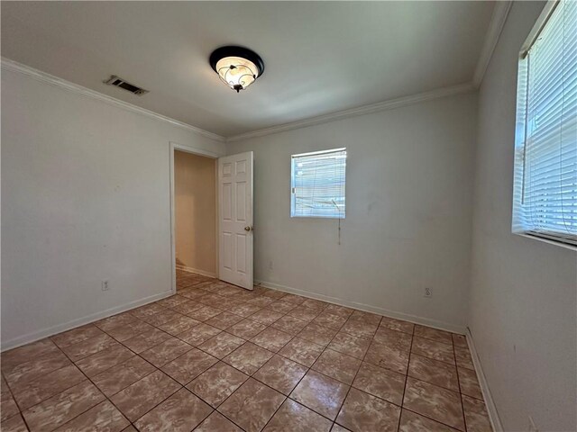 3855 Metropolitan St, New Orleans, LA 70126 - unfurnished room featuring ornamental molding, baseboards, and light tile patterned floors