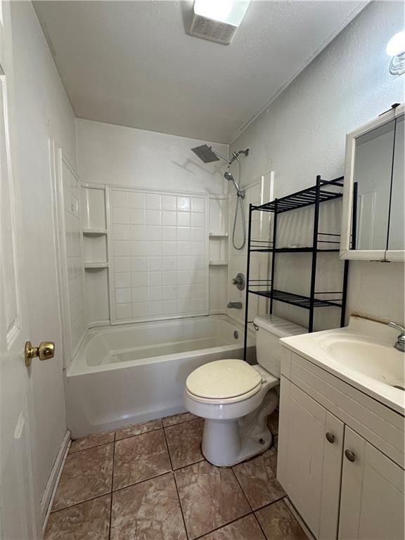 3855 Metropolitan St, New Orleans, LA 70126 - bathroom featuring toilet, shower / washtub combination, and vanity