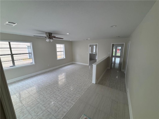 564 Oakwood Dr, Gretna, LA 70056 - unfurnished room featuring baseboards, a ceiling fan, recessed lighting, and light tile patterned floors