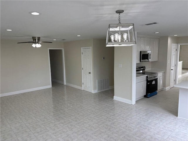 564 Oakwood Dr, Gretna, LA 70056 - kitchen with stainless steel appliances, light countertops, recessed lighting, a ceiling fan, and open floor plan