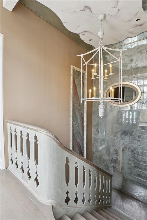 538 Governor Nicholls St, New Orleans, LA 70116 - staircase featuring a chandelier
