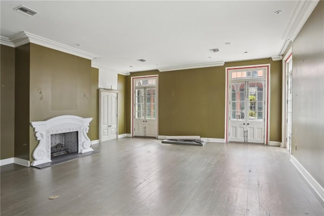 538 Governor Nicholls St, New Orleans, LA 70116 - unfurnished living room with french doors, ornamental molding, baseboards, plenty of natural light, and a fireplace with raised hearth