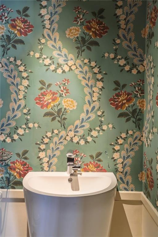538 Governor Nicholls St, New Orleans, LA 70116 - bathroom featuring a sink and a soaking tub