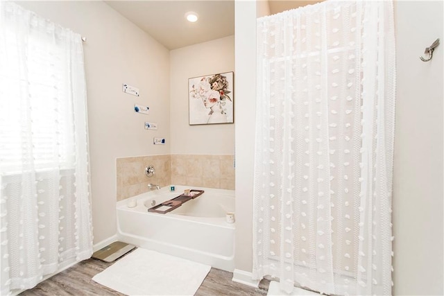 3663 Trestle Crossing Ave, Slidell, LA 70461 - full bath with wood finished floors, a garden tub, and baseboards