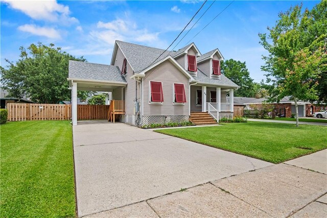816 Celeste Ave, River Ridge, LA 70123 - cape cod house featuring a porch, concrete driveway, roof with shingles, and an attached carport