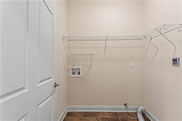 816 Celeste Ave, River Ridge, LA 70123 - laundry area with baseboards, washer hookup, and dark tile patterned floors