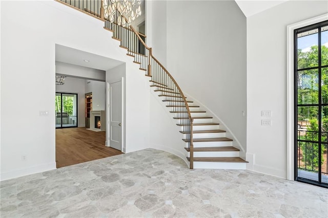 136 Linnette Ln, Mandeville, LA 70471 - entryway with a chandelier, stairway, healthy amount of natural light, and a towering ceiling