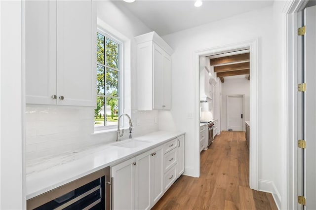 136 Linnette Ln, Mandeville, LA 70471 - hall with a sink, beverage cooler, light wood-type flooring, beam ceiling, and recessed lighting