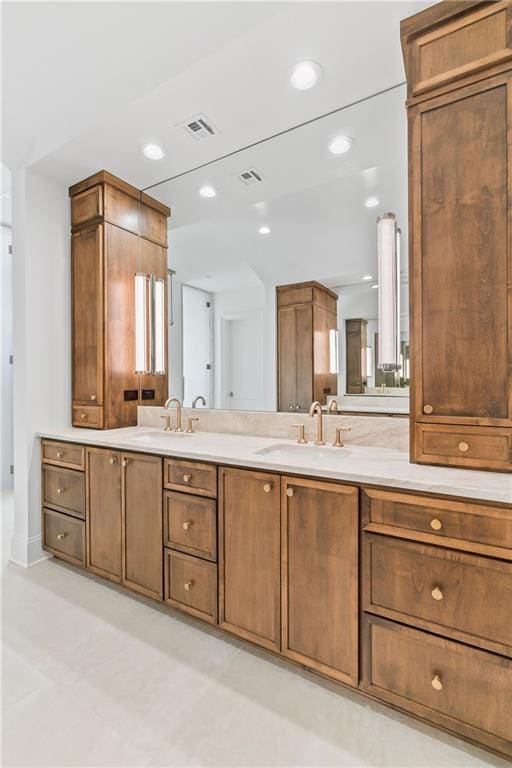 136 Linnette Ln, Mandeville, LA 70471 - bathroom featuring double vanity and recessed lighting
