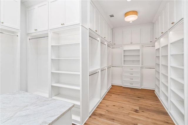 136 Linnette Ln, Mandeville, LA 70471 - spacious closet with light wood finished floors