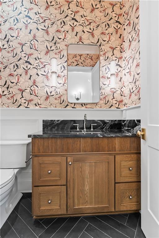 136 Linnette Ln, Mandeville, LA 70471 - bathroom with toilet, tile patterned flooring, vanity, and wallpapered walls