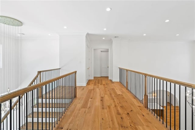 136 Linnette Ln, Mandeville, LA 70471 - hallway featuring crown molding, light wood-style flooring, recessed lighting, and baseboards