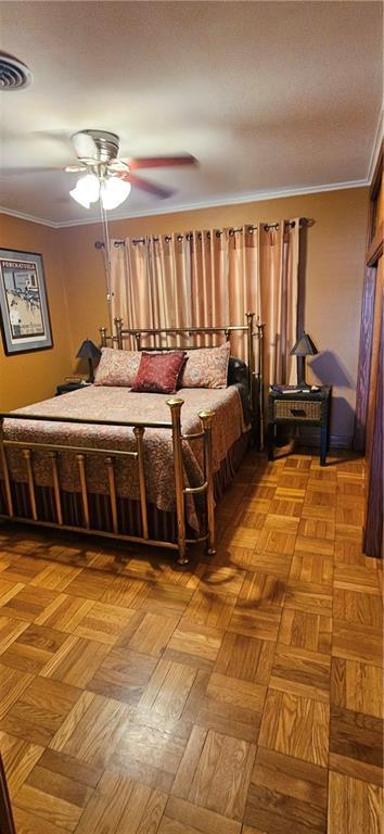 3231 47th St, Metairie, LA 70001 - bedroom with ornamental molding and a ceiling fan