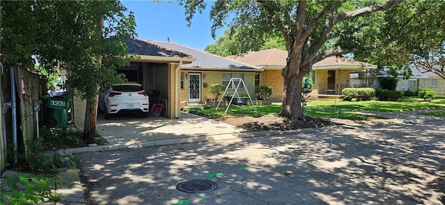 3231 47th St, Metairie, LA 70001 - single story home featuring driveway, a carport, and brick siding