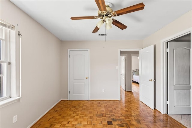 5504 Sabine Dr, Marrero, LA 70072 - unfurnished bedroom featuring baseboards and a ceiling fan