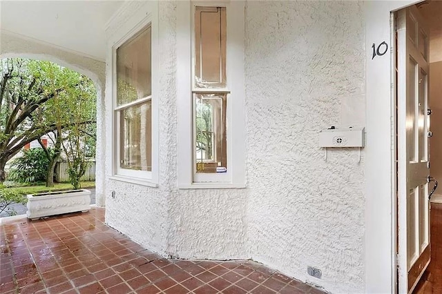 8-10 Neron Pl, New Orleans, LA 70118 - view of home's exterior with stucco siding