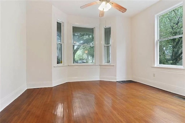 8-10 Neron Pl, New Orleans, LA 70118 - unfurnished room with hardwood / wood-style floors and ceiling fan