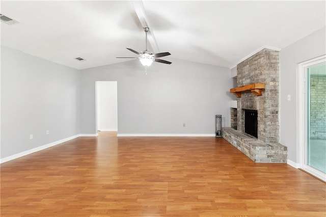 2701 Chenier St, Marrero, LA 70072 - unfurnished living room featuring ceiling fan, light wood-style flooring, a brick fireplace, and baseboards