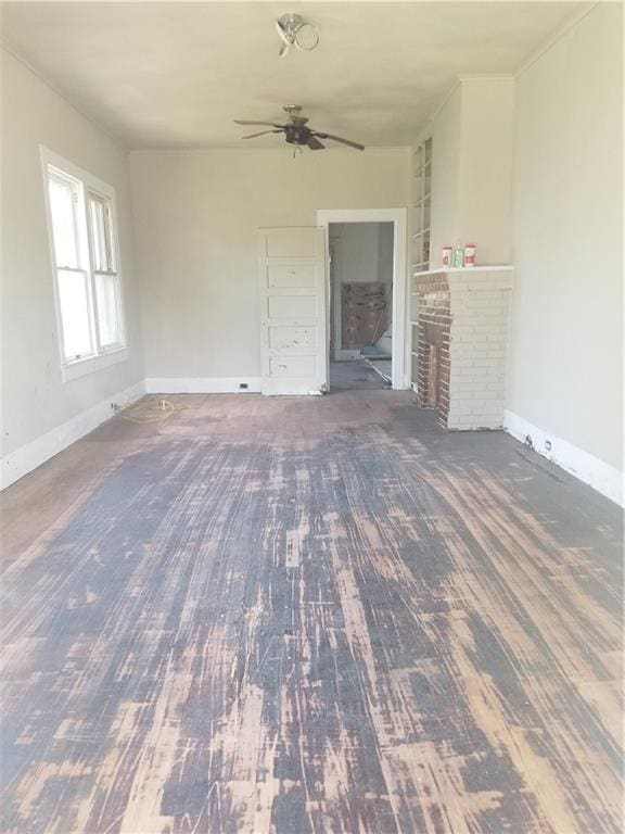 11921 Hesper Ave, Metairie, LA 70005 - unfurnished living room featuring a ceiling fan and a fireplace