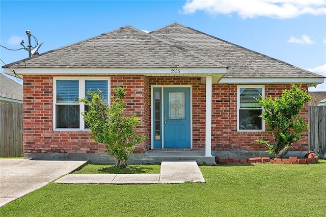 5926 Tullis Dr, New Orleans, LA 70131 - bungalow-style house featuring roof with shingles and brick siding
